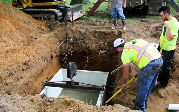 Heavy excavator preparing a residential site for foundation protection and drainage system installation in Fort Wayne, IN
